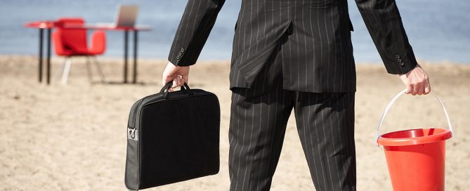 Businessperson with sand pail and briefcase