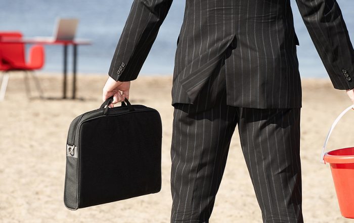 Businessperson with sand pail and briefcase