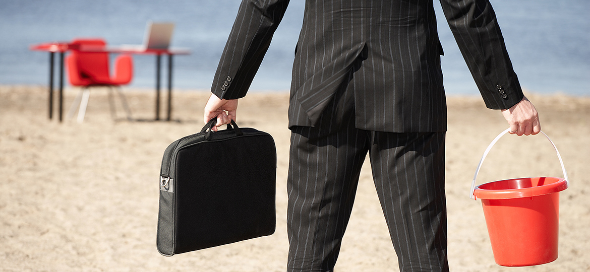 Businessperson with sand pail and briefcase