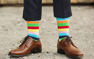 man in fancy, rainbow socks
