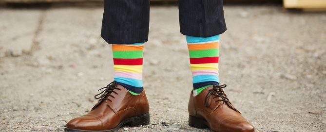 man in fancy, rainbow socks