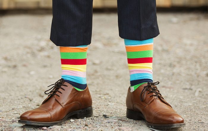 man in fancy, rainbow socks