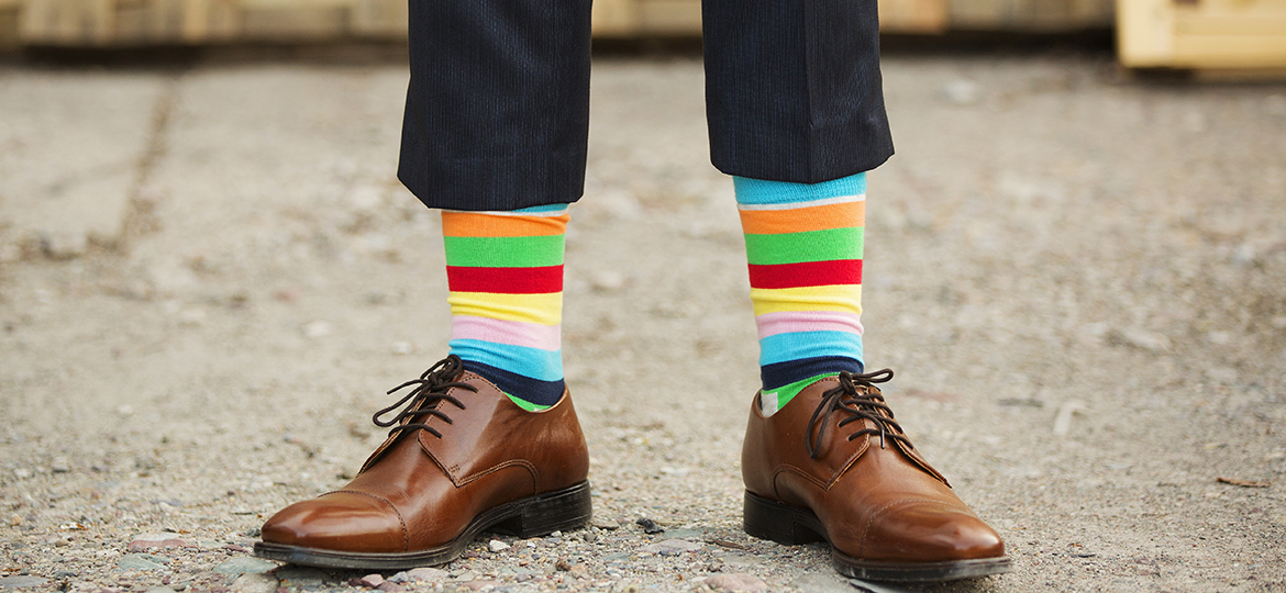 man in fancy, rainbow socks