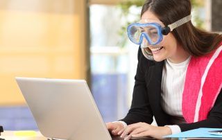 Businesswoman needing vacation booking at job