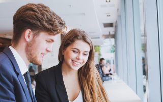 business people chatting in cafe at lunch or coffee break
