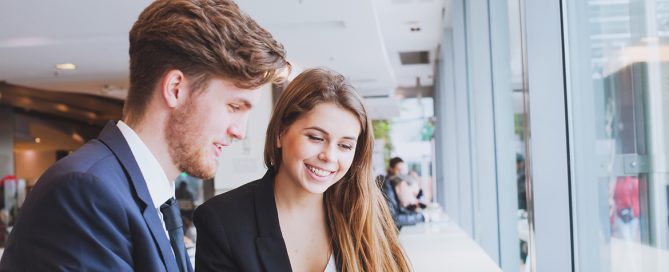 business people chatting in cafe at lunch or coffee break