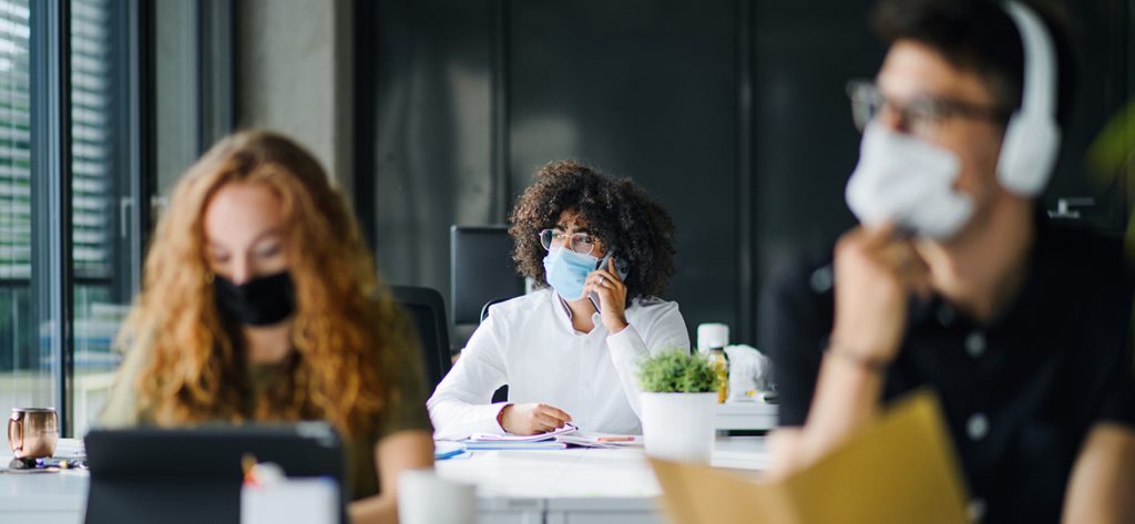 Young people with face masks back on campus amid coronavirus pandemic