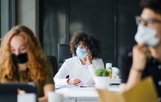 Young people with face masks back on campus amid coronavirus pandemic